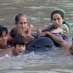 REFUGEES CROSSING THE BORDER